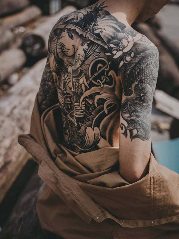 Photorealistic owl with feather detail tattoo